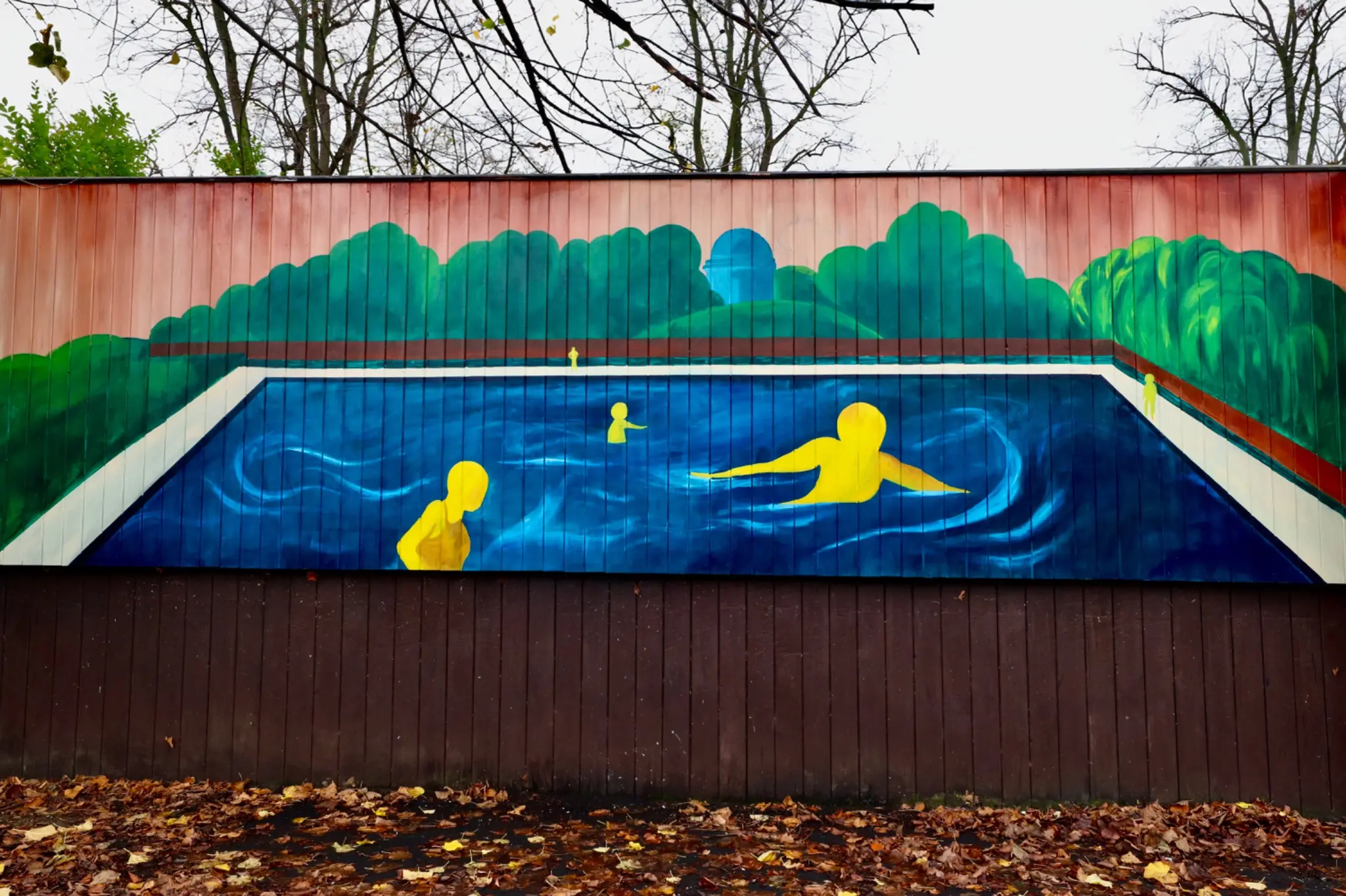 Painted pool scene with yellow swimmers at Jesus Green Lido